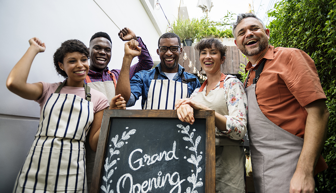 Business owners celebrating their grand opening